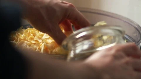 Parsnip chips being put into a jar Stock Footage 72509903