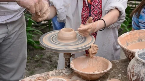 Part 2. Teaching how to make pottery on potter's wheel Stock Footage 50349295