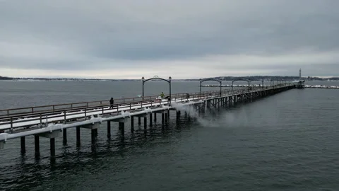 Part 4 - Drone of Man Snow Blowing a Winter Pier (White Rock, BC) Stock Footage 234596516