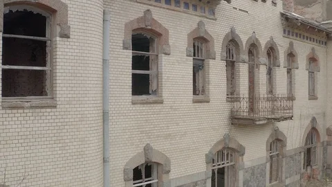 Part of an abandoned brick building, no windows Stock Footage 126697644