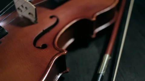 Part of aged violin on black background Stock Footage 73001350