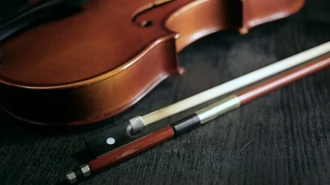 Part of aged violin on black background Video stock 73001468