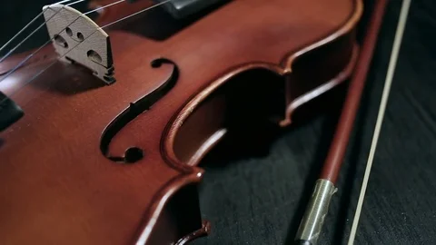 Part of aged violin on black background Stock Footage 73001532