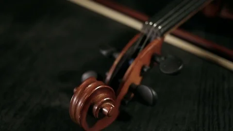 Part of aged violin on black background Stock Footage 73001666