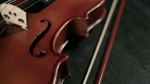 Part of aged violin on black background Stock Footage 73001790