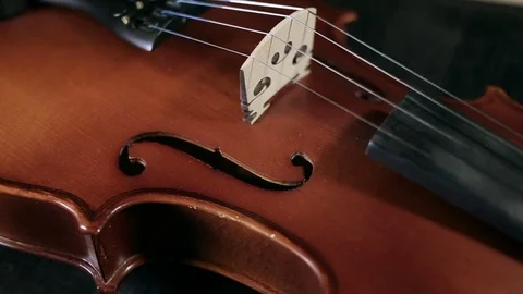 Part of aged violin on black background Video stock 73001847