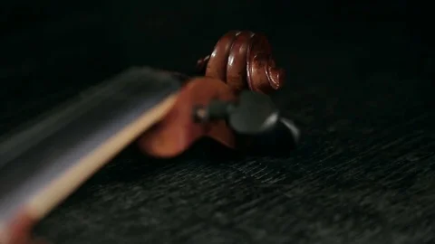 Part of aged violin on black background Video stock 73001863