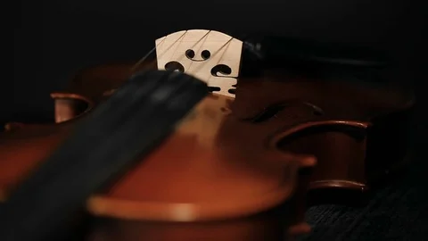 Part of aged violin on black background Stock Footage 73002140
