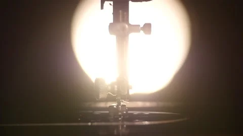 Part of antique working silver sewing machine, back light, slow motion, close up 스톡 동영상 49473149