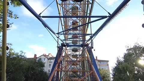 Part of attractions. Ferris wheel in summer on a sunny day Stock Footage 145686745