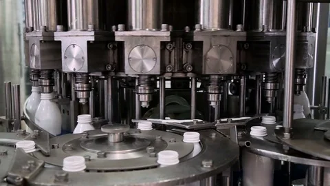Part Automatic Line for Bottling Milk . Filling the Bottles with Milk Stock Footage 71500041