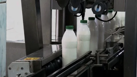 Part Automatic Line for Bottling Milk . Bottles on the Conveyor Stock Footage 71501042