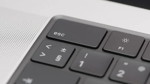 Part of the black keyboard in the frame. ACTION. Black keyboard in a silver Video stock 178042942