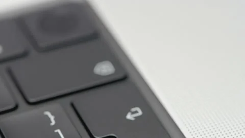 Part of the black keyboard in the frame. ACTION. Black keyboard in a silver Video stock 181616023