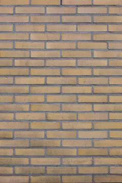 Part of brick wall with yellow bricks Stock Photos