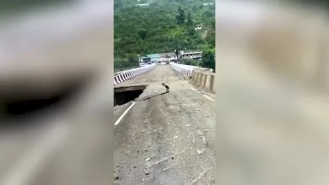Part of bridge collapses due to heavy rainfall in Hatkoti, Himachal Pradesh,... Stock Footage 247508319