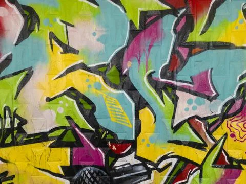 Part of a bright multi-colored wall graffiti. Stock Photos