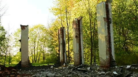 Part of the building after a fire, brick columns Stock Footage 138420087
