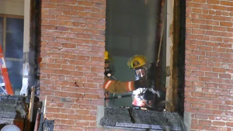 Part of the building almost falling on firefighter Stock Footage 139664409