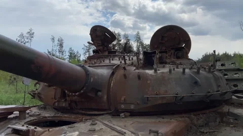 Part of a burnt Russian tank, muzzle. Detail of iron on a rusty armored car Stock Footage 241143641