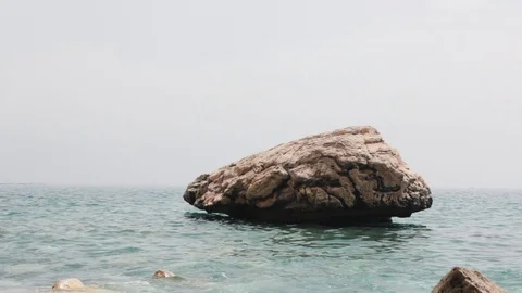 Part of the cliffs in the midst of the azure sea Stock Footage 111786533