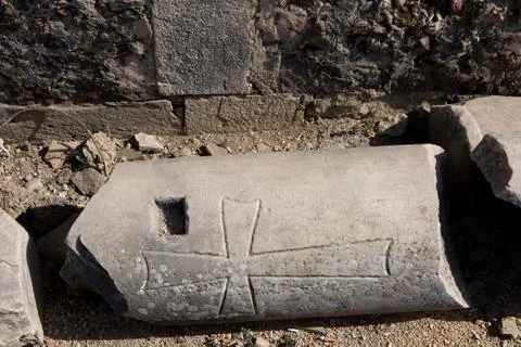 Part of the column with the image of the cross. Stock Photos