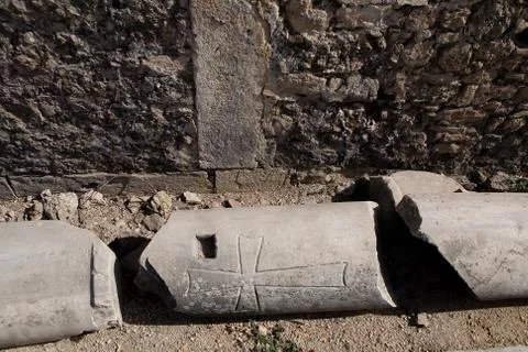 Part of the column with the image of the cross. Stock Photos