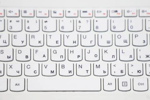 Part of the computer keyboard is white. Stock Photos