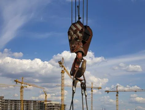 Part of a construction machine on the background construction site Stock Photos