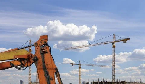 Part of a construction machine on the background construction site Stock Photos