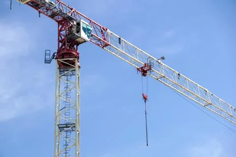 Part of a construction tower crane against the blue sky, copy space Stock Photos