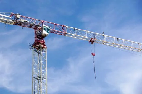 Part of a construction tower crane against the blue sky, copy space Stock Photos