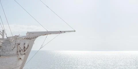 Part of the construction, which looks like an old wooden white sailing ship. Stock Photos