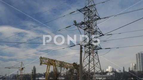 Part of the crane and electricity pylon. Stock Photos