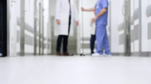 Part of doctors walking through corridor in hospital Stock Footage 105219629