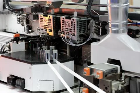 Part of double side automatic edge banding machine Stock Photos