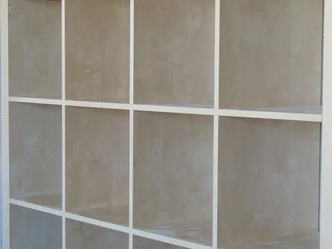 Part of an empty bookcase viewed from an angle Stock Photos