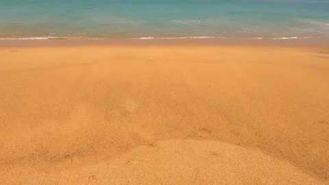 Part of an empty sandy beach with beautiful waves. Stock Footage 242166666