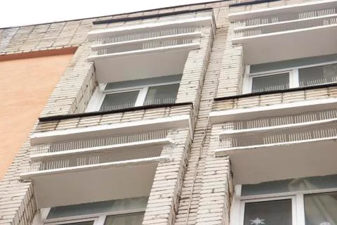 Part of the facade of the building with plastic spikes against pigeons. the Stock Photos