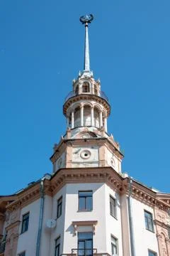 Part of the facade of the old building with a spire and a star, Stalin's Empire Stock Photos