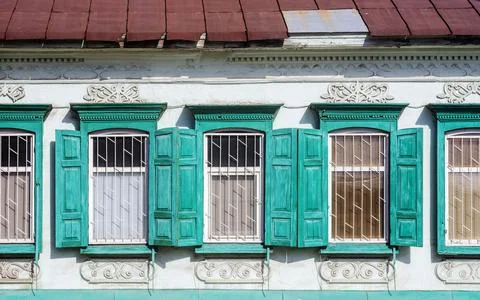 Part of the facade with windows of an ancient building Fotos de archivo