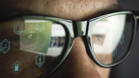 Part of the face of a man wearing glasses. In the reflection of the glass pages Stock Footage 263880446