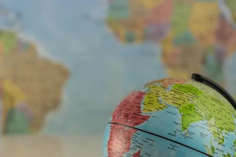 Part of a globe with map of India with blurred map as background Stock Photos