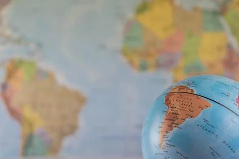 Part of a globe with map of India with blurred map as background Stock Photos