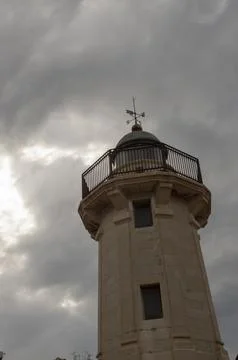 Part of the grao lighthouse with cloudy sky in the background Stock Photos