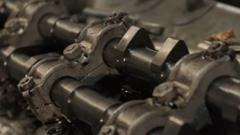 Part of a heavy vehicle engine. Close-up of the crankshaft. Slow motion. Stock Footage 260624392