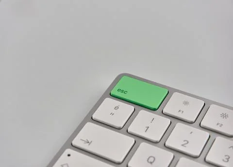 Part of a keyboard with green esc button Stock Photos