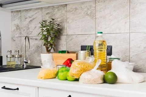 Part of kitchen with different food on table. Charity concept. Food basket 스톡 사진