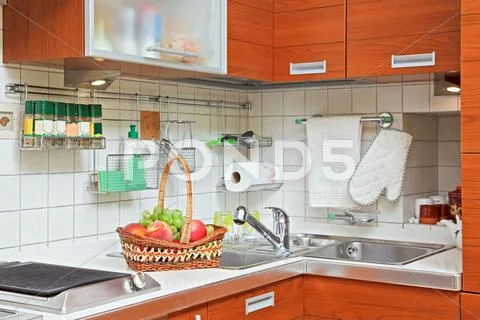 Part of kitchen interior with wooden furniture and sink Stock-Fotos