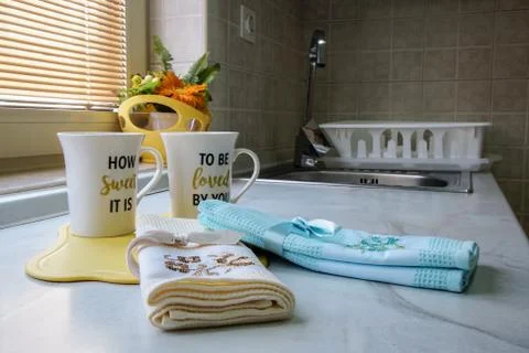 Part of the kitchen where cups and towels are placed Stock Photos